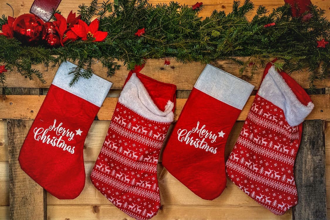A row of red Christmas stockings hanging